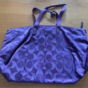 Large purple Coach travel bag